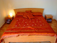 Mount Valley Goa, King Size Wooden Bed with comfortable mattresses and deluxe bed linen.