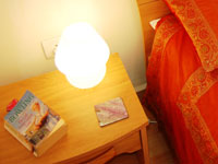 Mount Valley Goa, Wooden bedside cabinets with night lamps.